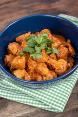 indian butter chicken dish with cilantro on top