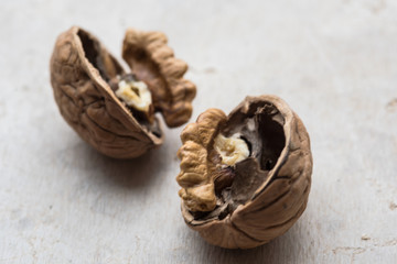 Delicious walnut on stone plate broken hard shell.