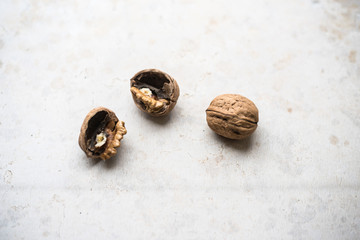 Delicious walnut on stone plate broken hard shell.