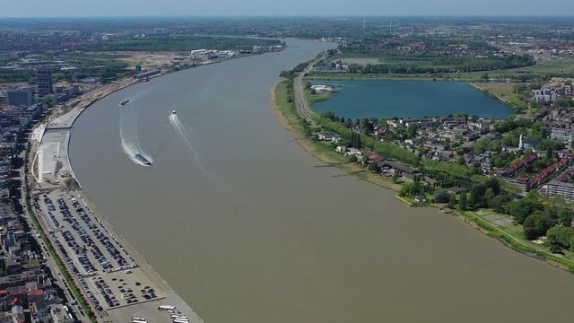 Aerial view of cityscape of Antwerp, modern part of city, residential areas and river Scheldt - landscape panorama of Belgium from above, Europe