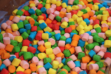 Background of sweet souffle in blue, green, yellow and red colors