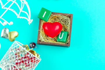 Red heart in wood box with straw and mini bike on blue background for love and Valentine idea  concept to romance.