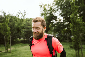 Fototapeta premium A young and handsome man goes on hiking