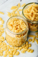 Two kinds of Italian whole wheat pasta in glass jars