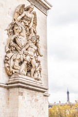 Fototapeta na wymiar Paris, France - APRIL 9, 2019: Detais of the Arc de Triomphe on a cloudy day, Paris