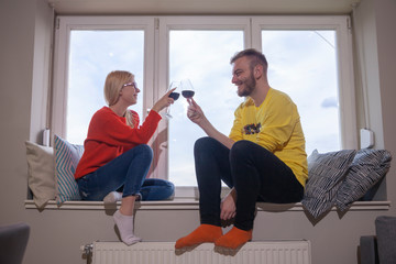 Obraz premium brother and sister toasting to each other.