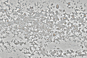 Peeling paint with dirty marks on the concrete. The texture of dried paint that will climb off the ceiling. Background of old wall with traces of rust.