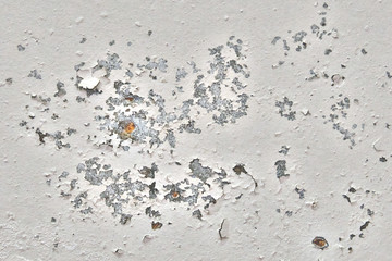 Background of old wall with traces of rust. Peeling paint with dirty marks on the concrete. The texture of dried plaster that falls off the wall.