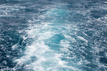 Fototapeta na wymiar Boat Wave ocean trace on blue sea Red Sea Seashore Egypt background.
