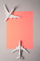 Two  jet airplane on pastel color background. Travel around the world.