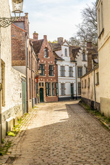 Fototapeta na wymiar Bruges, Belgium - APRIL 05, 2019: Streets of the medieval city of Bruges