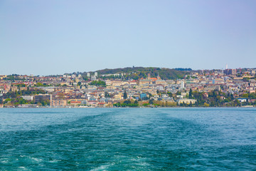 Fototapeta na wymiar Panorama of Lausanne city taken from boat on Geneva Lake