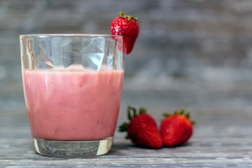 Glass with delicious strawberry milkshake