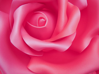 Fototapeta na wymiar Background - Imitation of a rose flower. A closeup of a bud, petals.