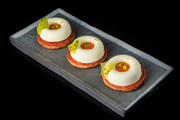 three cookies with white mousse cream and jam filling