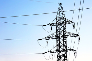 masts and wires on a background blue sky.. electric power industry.