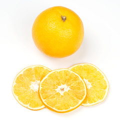 Obraz na płótnie Canvas fresh orange and pieces of dried orange on white background