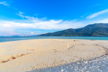 Clear water and blue sky at the paradise island in the tropical sea of Thailand