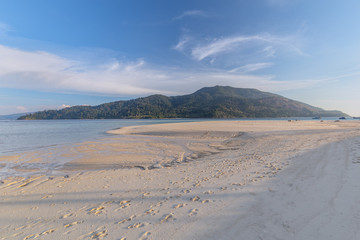 Clear water and blue sky at the paradise island in the tropical sea of Thailand