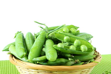 fresh open green pea pods and green peas isolated on the white background