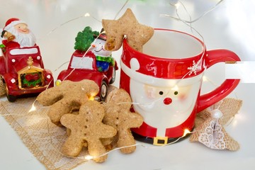 Tasty ginger man cookies with red cup