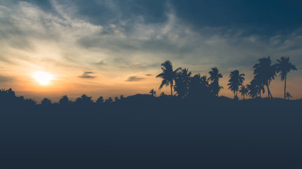 Happy Parents and Daughter are traveling on natural scenery at sunsetn in thailand.Family concept