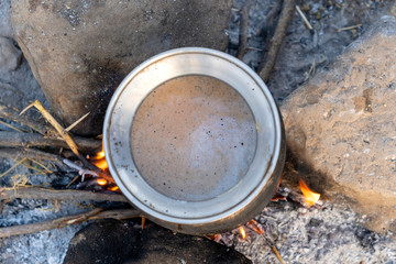 Cooking masala tea on a fire in the Thar desert near the town of Pushkar, Rajasthan India. Close up