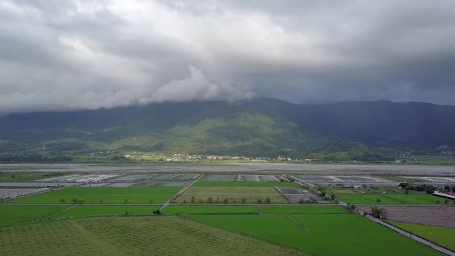 Aerial view of rice fields in Yuli, a township in the eastern rift valley, Hualien County, Taiwan.   - crane down