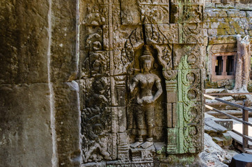 Fototapeta na wymiar Apsara Decoration Detail of Ta Prohm Temple is The One Attractive Temple In Angkor Thom Area at Siem Reap Province, Cambodia.
