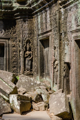 Fototapeta na wymiar Apsara Decoration Detail of Ta Prohm Temple is The One Attractive Temple In Angkor Thom Area at Siem Reap Province, Cambodia.
