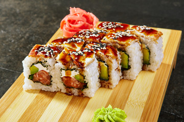 Kanada sushi rolls with salmon, eel, Philadelphia cheese, avocado and cucumber