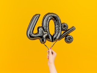 Forty percent symbol discount. 40 % sale banner black flying foil balloons on yellow. 3d rendering.