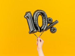 Ten percent symbol discount. 10 % sale banner black flying foil balloons on yellow. 3d rendering.