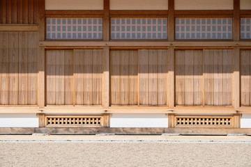 The exterior of Japanese architecture presents wooden doors and raised floors.