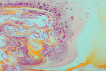 photography of abstract marbleized effect background. mint, pink and purple creative colors. Beautiful paint
