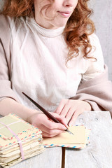 Young woman writing a letter.