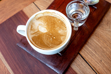 Latte hot coffee in a white cup