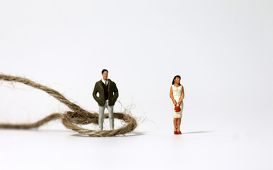 Ropes and miniature people. The concept of gender inequality.
