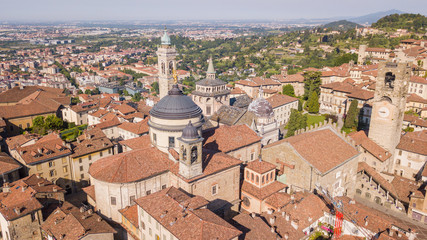 Fototapeta na wymiar Bergamo, Italy. Amazing drone aerial view of the old town. Landscape at the city center and its historical buildings