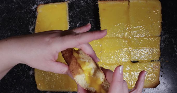 Reverse Time Lapse Of Woman Squeezing Both Sides Of Portuguese Dessert To Keep It Triangular Shaped 4K 30FPS - Triangle shaped, Desserts, International