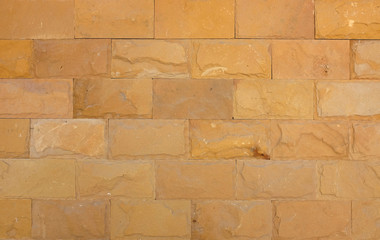 Obraz premium Yellow brick stone texture background.