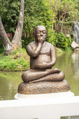 Fototapeta na wymiar Gag statue for to Know how to control what you should say or should not say in Thailand