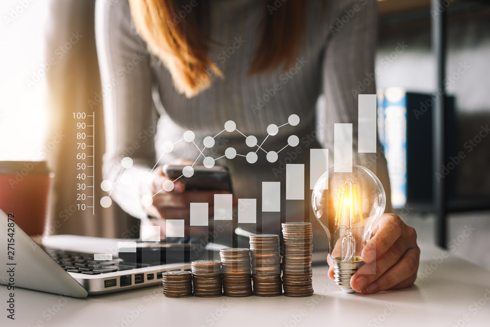 Poster business man hand holding lightbulb with using smartphone and calculator to calculate and money stac
