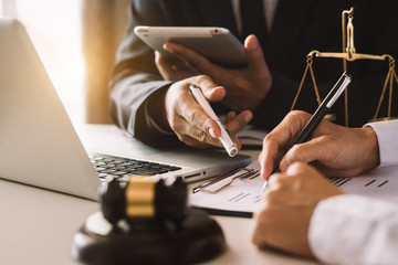 business people and lawyers discussing contract papers sitting at the table. Concepts of law,...
