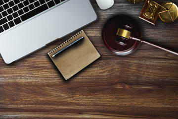  Justice and law concept.Lawyer workplace with laptop and documents with notepad,smartphome. top view 
