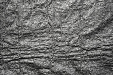 Abstract background from black plastic bag texture with grunge.