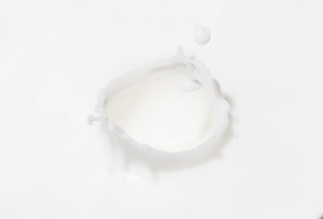 Close up of white milk splash and drop on white background