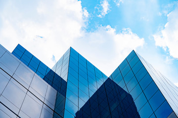 Modern buildings with blue sky and cloud in sunny day.