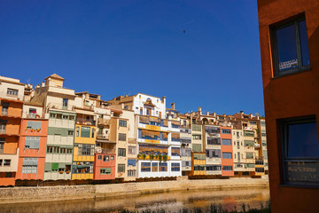 Fototapeta na wymiar Girona. Colorful houses on the river Onyar. Beautiful town of Girona, Catalonia, Spain