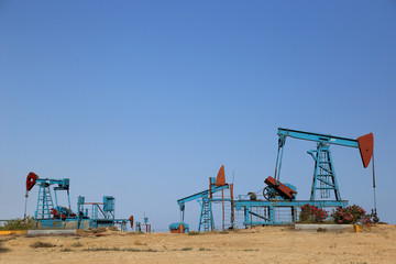 Baku, Azerbaijan - June 24, 2018: ground drive of a sucker-rod pump during operation of oil wells.